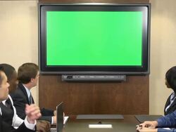 Business Professionals in Front of Chroma Key Monitor Stock Footage