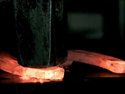 CU hammer hitting red hot horseshoe, high speed Stock Footage