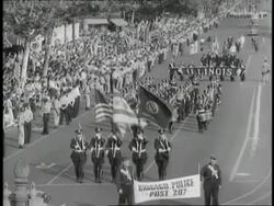 American Legionnaires proudly march in a parade. News Clip