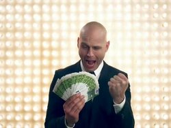 Man with money in front of lightwall Stock Footage