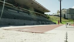 Male long jumper running and jumping Stock Footage