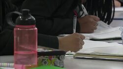 Secondary school pupils doing fractions News Clip