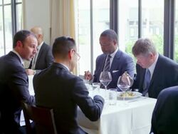 MS group of businessmen having meeting in restaurant Stock Footage