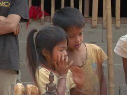 ZO American tourist buys trinkets at small village near Luang Prabang / Luang Prabang, Laos Stock Footage