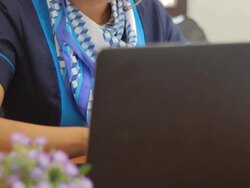 Businesswoman wearing headset using computer Stock Footage