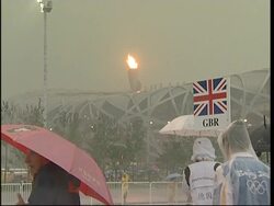 WRAP Heavy rain delays races, dampens crowds ADDS voxpops News Clip