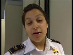 Airport security officers use handheld scanners to inspect liquids News Clip