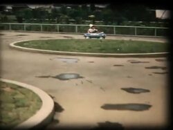 60's 8mm footage - Boy playing with a toy car Stock Footage