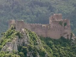 MS AERIAL Shot of Puilaurens Cathar Castle with forest / Languedoc Roussillon, France Stock Footage