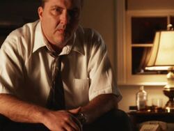 depressed man sitting looking at the camera Stock Footage