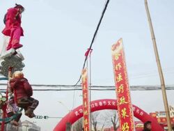 MS TU TS Children dressed as ancient figures stand on specially designed machinery covered by clothes on tractor during shehuo celebrations, Shehuo is traditional festive folk celebration during chinese spring festival AUDIO / xi'an, shaanxi, china Stock Footage