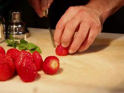 MS Barman preparing strawberry and sake caipirinha, typical Brazilian drink / Sao Paulo, Brazil Stock Footage