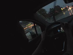 MS POV Driver behind wheel of electric car during evening hours / Rochester, Michigan, United States Stock Footage