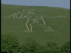 Cerne Abbas Man, Dorset - giant chalk carving on grassy hillside, fertility symbol Stock Footage