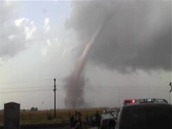 Long slender tornado Harper, Kansas, zooms in to base of funnel and debris cloud, WA, USA Stock Footage