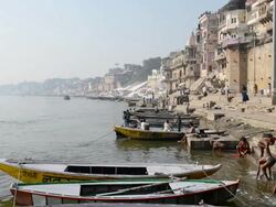 MS Bathers and boats at river ganges / Varanasi, Utter Pradesh, India  Stock Footage