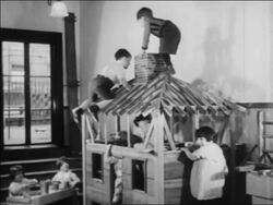 B/W 1934 children climbing playhouse in nursery school / WPA project / newsreel Stock Footage