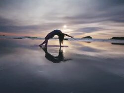 WS POV Woman doing yoga on beach / Bandon, OR, United States  Stock Footage