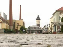 Low Angle static-A restaurant is across a cobblestone street from the Pilsner Urquell brewery.   Stock Footage
