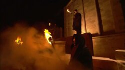 Robed and masked monks waves flaming torches in front of a temple in Saqqara, Egypt. Stock Footage