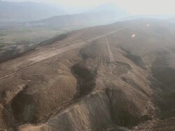 WS AERIAL DS ZI View over Nazca lines with artistic designs / South Of Peru, Nazca, Peru Stock Footage