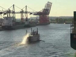 WS View of small boat with container ships on container terminal in harbour / Hamburg, Germany Stock Footage