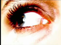 OVEREXPOSED extreme close up eye looking around + blinking Stock Footage