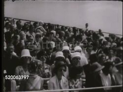 1963: UNITED STATES AIR FORCE ACADEMY: VS Five first year cadets marching during graduation ceremony, people watching, cadet being awarded Cadet Sword, saluting, Generals watching including Robert H. Warren. Rampart Range Instructional Video