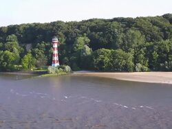 WS Side POV View of Lighthouse at Rissener Ufer near Elbe river / Wedel, Schleswig Holstein, Germany Stock Footage