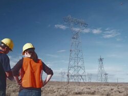 WS TU Workers discussing plans under power lines / Zillah, Washington, USA  Stock Footage