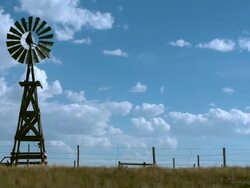 Old fashioned rural windmill water tower Stock Footage