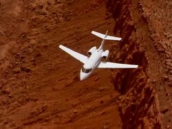 Aerial high angle private jet flying above Grand Canyon / Arizona Stock Footage