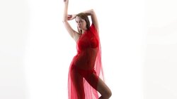 Fashion model in bikini with flowing red fabric Stock Footage