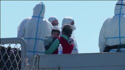 Rescued migrants disembark Navy ship Instructional Video