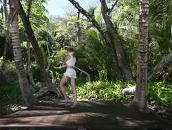 MS Ballerina dancer dancing in point shoes on wooden stage surrounded by palm trees / Montezuma, Nicoya Peninsula, Costa Rica Stock Footage