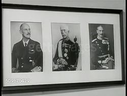 1943: NORWEGIAN REFUGEES: Women, men w/ rolled backpacks walking on rural road from Norway, walking up building steps. FREE FRENCH OFFICES: Office w/ elder male speaking to two typists. WS EXT Free French offices. Free French delegation reception line Instructional Video