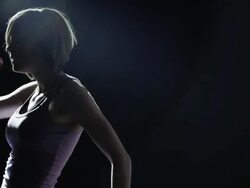 SLO MO MS PAN Studio shot of young woman dancing Stock Footage