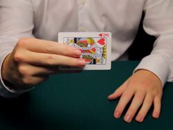 CU man changing king to ace Stock Footage