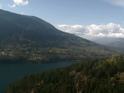 Aerial view of a village near the mountains Stock Footage