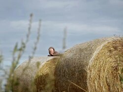 Boy on straw bale Stock Footage