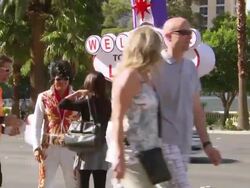 MS Lady taking picture with man and las vgeas dressed up man / Las Vegars, United States Stock Footage