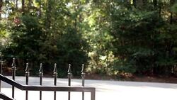 Wrought iron gate closing to the right. Home driveway. Stock Footage