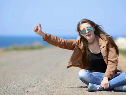 girl hitchhiking Stock Footage