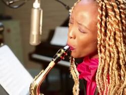 MS Shot of black woman playing saxophone in recording studio / Santa Fe, New Mexico, United States Stock Footage