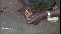 Rwandan Soldier Loading Bullets News Clip