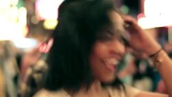 young woman dances with friends at outdoor concert in downtown Las Vegas Stock Footage