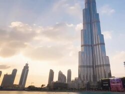 Time Lapse of Burj Khalifa at sunset, day to night, zoom out Stock Footage