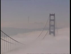 MS High angle Golden Gate Bridge steeped in heavy fog, zoom out to both supporting towers, San Francisco Stock Footage