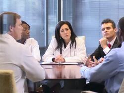 Female Doctor Leads a Meeting with Professionals - WS Stock Footage