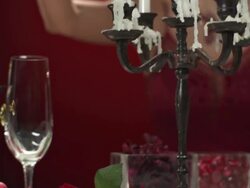 HD DOLLY: Glamorous Woman Lighting Up Candles Stock Footage